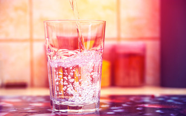 Glass of pure water on kitchen table