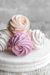Assorted different flavors of homemade marshmallows. Peach, pink and white marshmallows.