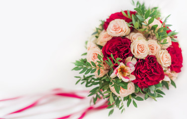 bright wedding bouquet with red and cream roses, Orchid and satin white and red ribbons on a white background. Valentine's day. Postcard. Background