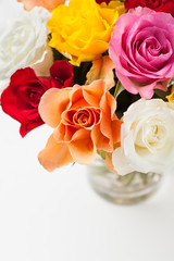 Bouquet of multicolored roses in vase