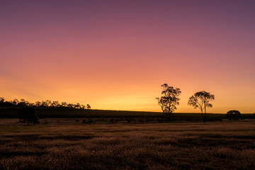 Fototapeta na wymiar Sunset Over Dry rural Australian Landscape