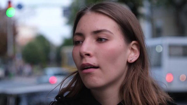 Closeup portrait excited, optimistic woman having solution, and then crying, bored annoyed disappointed girl at street background. Human emotions, expressions, feelings. Bipolar disorder concept