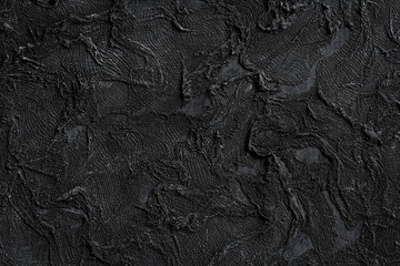 black grunge textured surface as background