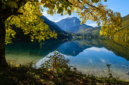 Peaceful autumn Alps mountain lake with clear transparent water and reflections. Langbathseen lake, Upper Austria.