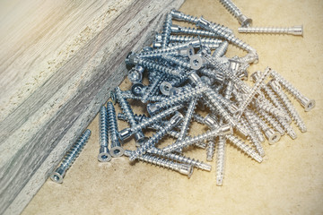 Screw-on for furniture. Metal screw. Vertical. Metal screws. Furniture fittings and fittings. Stainless steel. Realistic.