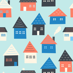 Seamless pattern of houses. Light blue background