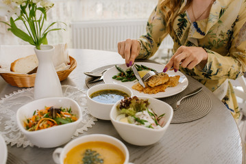 Woman at the restaurant eating her business lunch, close up