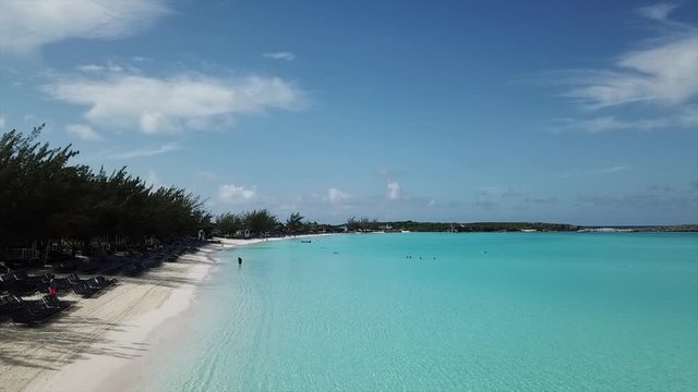 Summer day footage of sandy island beach with unique  turquoise water and blue sunny sky done by drone in high resulution