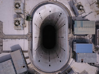 Kuching, Sarawak / Malaysia - November 15 2019: Creative shot - an aerial top down view of a donut shaped building in Kuching, the island of Borneo. The core of the building was empty.