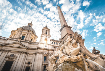 Fototapeta na wymiar Fountain in Piazza Navona under Sun and Blue Sky, Rome, Italy