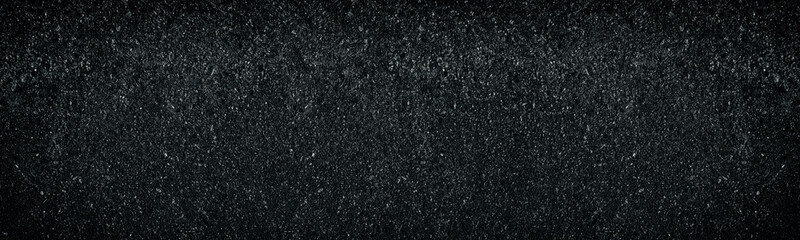 Wide dark weathered concrete wall texture. Abstract widescreen background