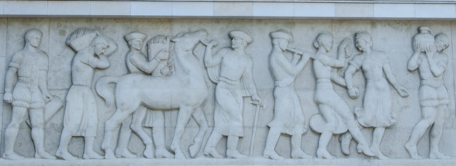 basrelief of people and horse