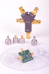 RF mixer electronics PCB in front of Smith chart and other microwave measurement tools and symbols - obrazy, fototapety, plakaty