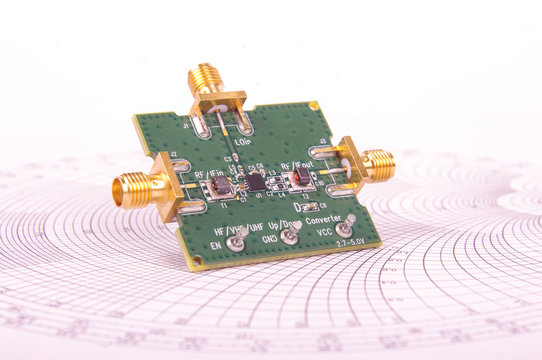 Radio Frequency Mixer PCB In Front Of Smith Chart