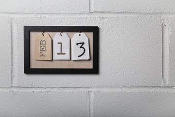 Wall Hanging Calendar in a Picture Frame Showing February 13