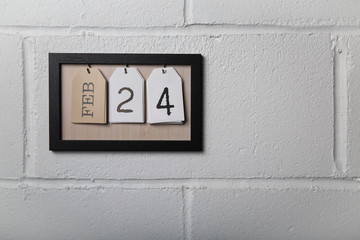 Wall Hanging Calendar in a Picture Frame Showing February 24
