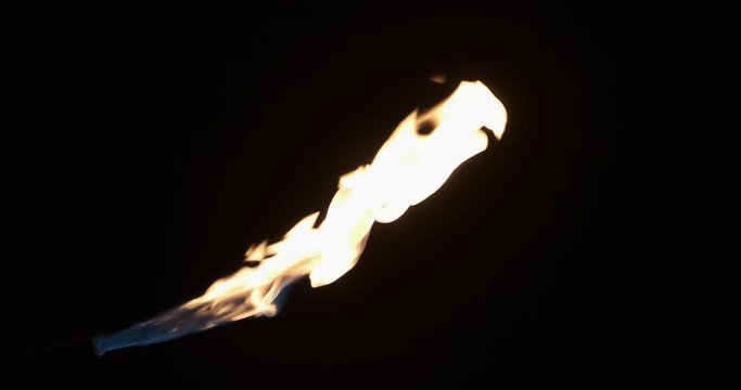 Intense gas jet flame of a gas burner. Smooth increase and decrease of a single stream of flame.