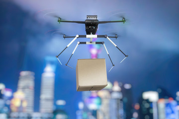 A cargo flying drone drops a load. Mixed media.