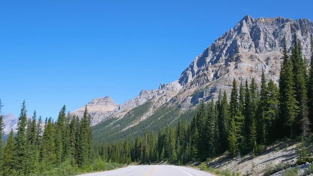 view from the front of the car while moving along the icefield parkways in Banff National park, Canada