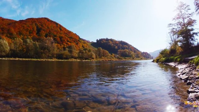 Poprad River in sunny autumn day. Rytro, Poland.