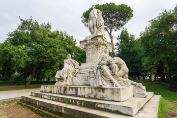 Fototapeta na wymiar Monument of Wolfgang Goethe, built in 1904, in Villa Borghese public park, Rome, Italy