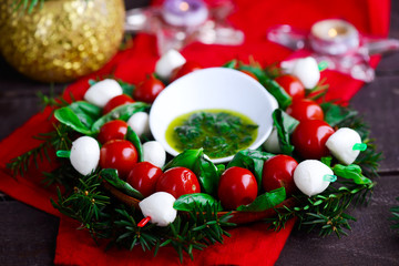 Caprese on skewers in Christmas backgrownd