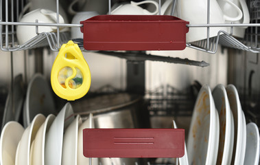 The yellow odor remover hangs in the dishwasher and neutralizes odors. Air freshener dishwasher