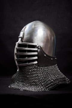 Knight helmet on a black background. Side view.