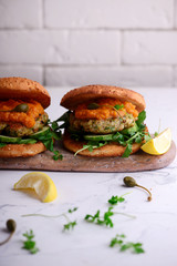 Fish burger with herb and corgette sauce.