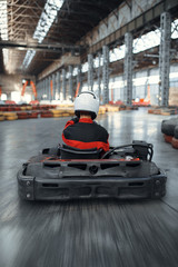 Racer in helmet driving go kart car © Nomad_Soul