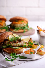Fish burger with herb and corgette sauce.