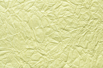 Crumpled paper texture in light beige color as part of your greeting card.