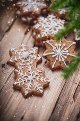 Fototapeta na wymiar christmas gingerbread cookies on wooden background