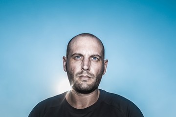 Fototapeta premium portrait of a man with sun behind