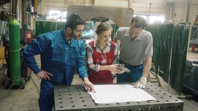 Worker in factory or workshop discussing project
