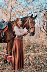 Beautiful woman posing with horse outdoors.