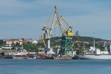 Fototapeta na wymiar Industrial landscape with cranes in the seaport of Sevastopol