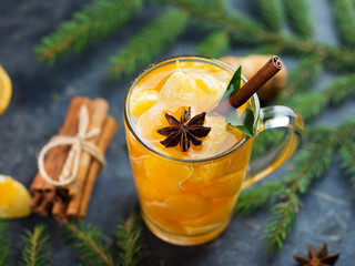 Delicious creative Christmas and new year drink mulled wine with tangerines, cinnamon and anise on...