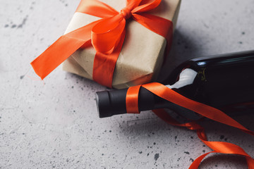 A bottle of wine and a gift box for the holiday