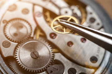 Fototapeta na wymiar Watchmaker is repairing the wristwatch, mechanical watch