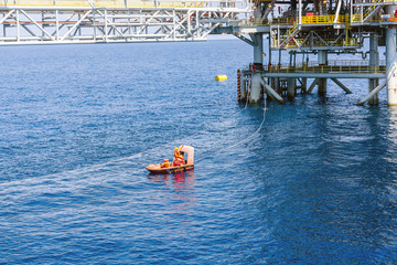 Fast rescue craft maneuvering at oil field during an emergency drill exercise 