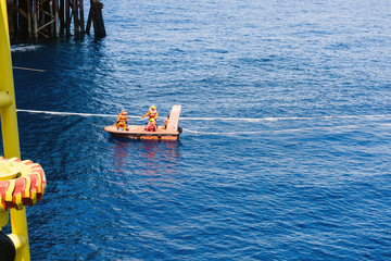 Fast rescue craft maneuvering at oil field during an emergency drill exercise 