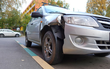 Obraz na płótnie Canvas Broken passenger car close-up. Accident, car repair.