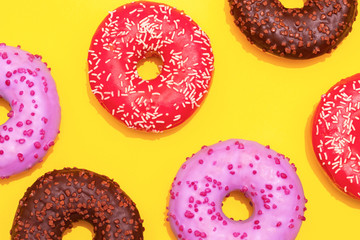 assorted donuts on a yellow background