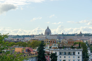 Fototapeta na wymiar panorama of Rome with the Vatican dome in the background from the public park Pincian Hill, Villa Borghese gardens, Rome, Italy