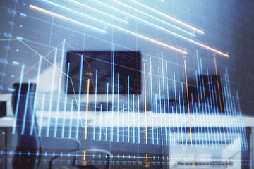 Stock market chart and desktop office computer background. Multi exposure. Concept of financial...