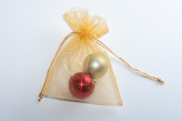 Gold shiny gift bag with christmas tree decorations