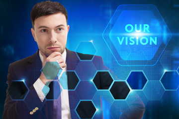 Business, Technology, Internet and network concept. Young businessman working on a virtual screen of the future and sees the inscription: Our vision