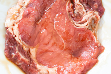 Closeup raw of beef with soy sauce prepare for yakiniku steak