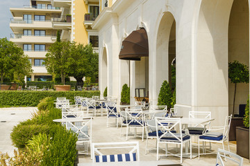 Fototapeta premium Cozy and beautiful street cafe on the sea promenade in Tivat, Montenegro.